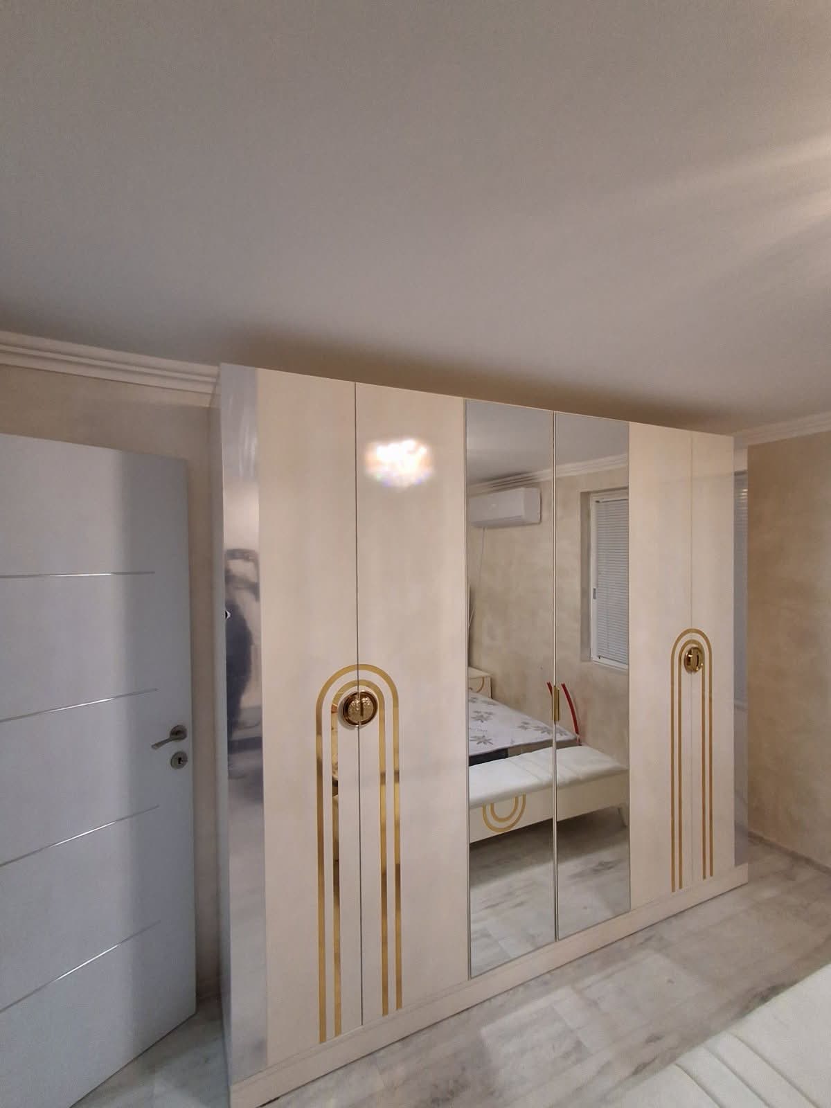 Ivory and gold mirrored wardrobe