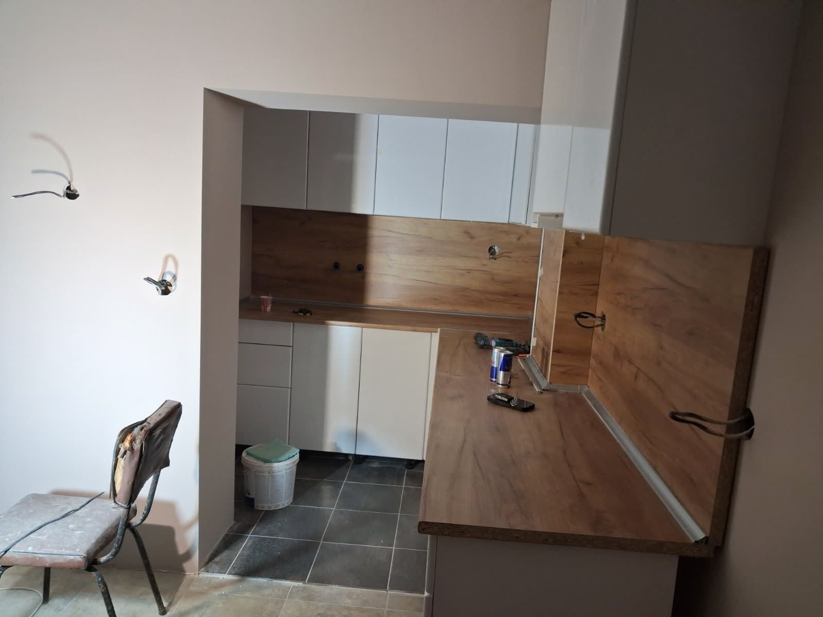 Compact fitted kitchen with breakfast bar