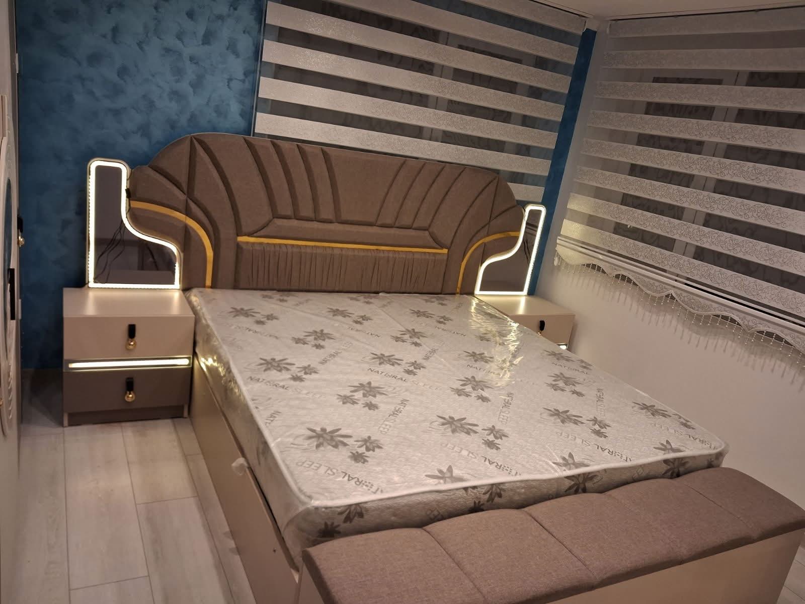 Upholstered bed with shell headboard