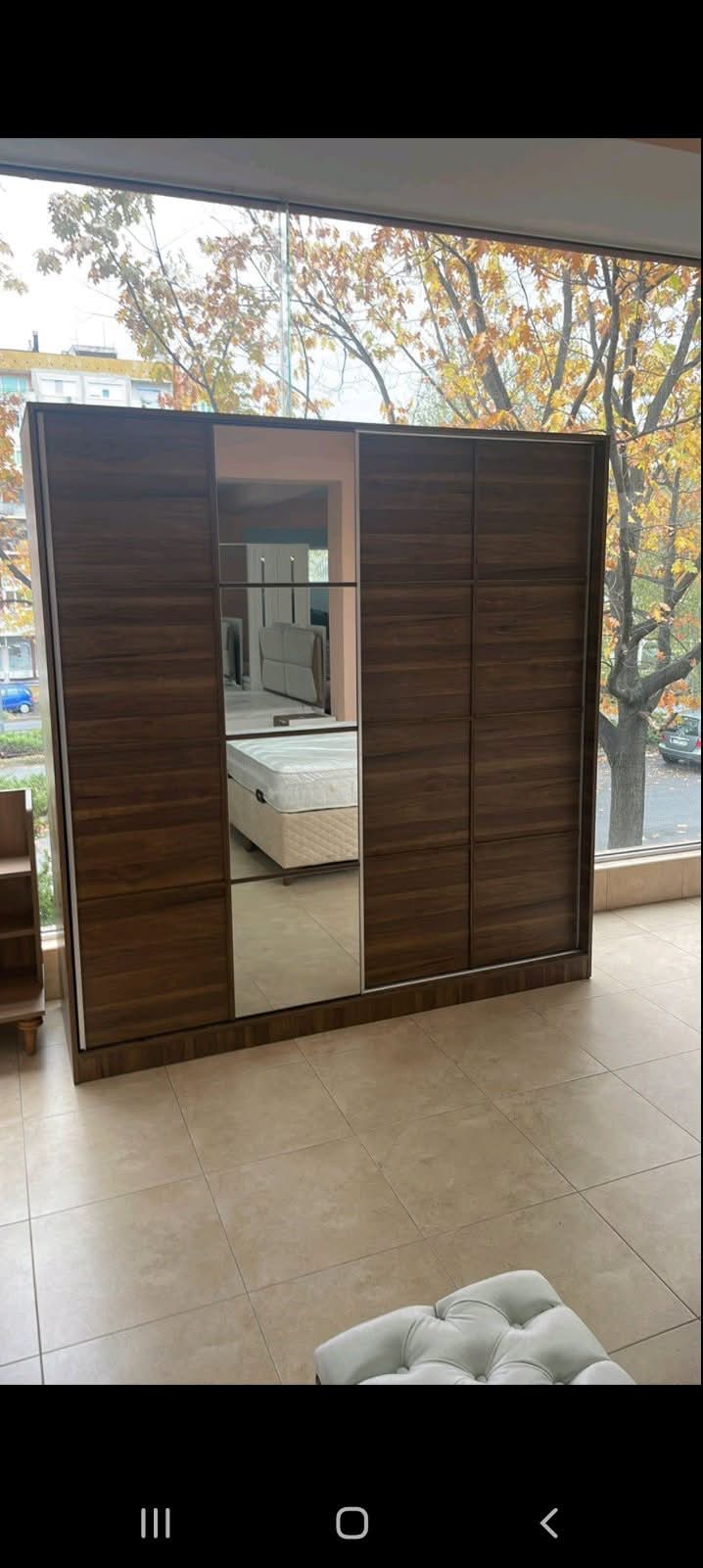 Walnut sliding-door wardrobe
